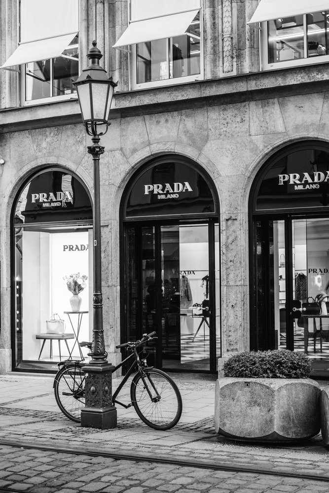 Prada shop building with personal driver assisting